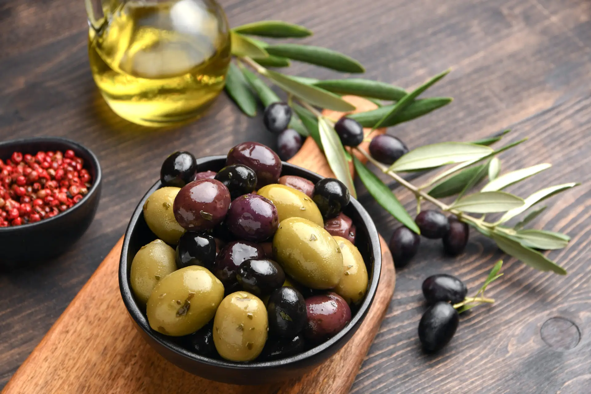 Mixed green olives and black olives with olive oil, healthy eati